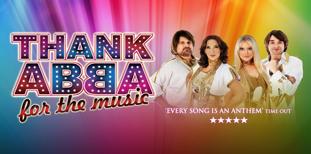 Promotional poster for the tribute show “Thank ABBA for the Music.” The text is displayed in colorful, illuminated letters against a rainbow gradient background. Four performers dressed in 1970s-style gold and white ABBA-inspired costumes stand on the right. Below the title, the tagline reads: “Every song is an anthem” – Time Out, followed by a five-star rating.