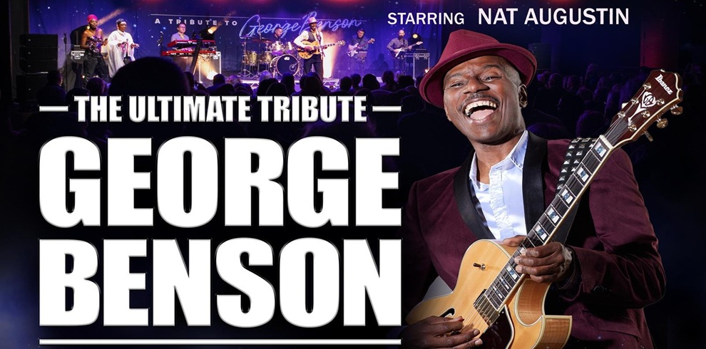 Promotional poster for “The Ultimate Tribute George Benson.” Large bold white text dominates the left side, reading “GEORGE BENSON.” Above, smaller text says “Starring Nat Augustin.” The background shows a live band performing on stage under purple and blue lights with an audience in front. On the right, a musician wearing a burgundy suit and hat holds a light-colored electric guitar, positioned prominently in the foreground.
