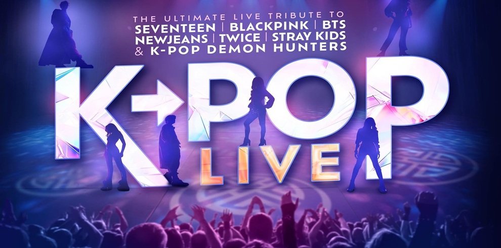 Promotional poster for a K-pop live tribute event featuring silhouettes of performers against a vibrant purple and blue stage background. Large text reads ‘K-POP LIVE’ in bold letters with a colorful gradient. Above, smaller text lists tribute acts including Seventeen, Blackpink, BTS, NewJeans, Twice, Stray Kids, and K-Pop Demon Hunters. The bottom shows a cheering crowd with raised hands.