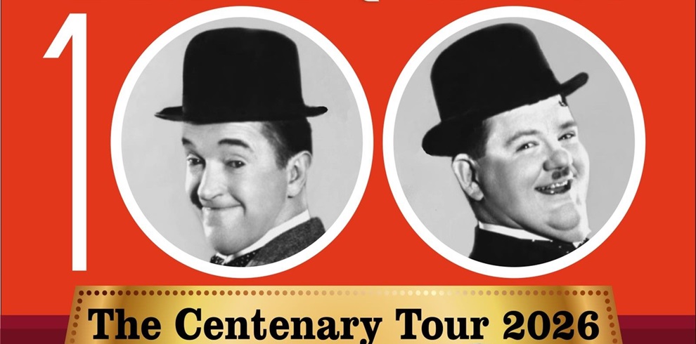 Promotional graphic with a bright red background featuring two black bowler hats inside white circles, symbolizing a classic comedy duo. Large white number ‘100’ is partially visible, and a gold banner at the bottom reads ‘The Centenary Tour 2026.’ The design conveys a celebratory theme for a 100-year anniversary tour.