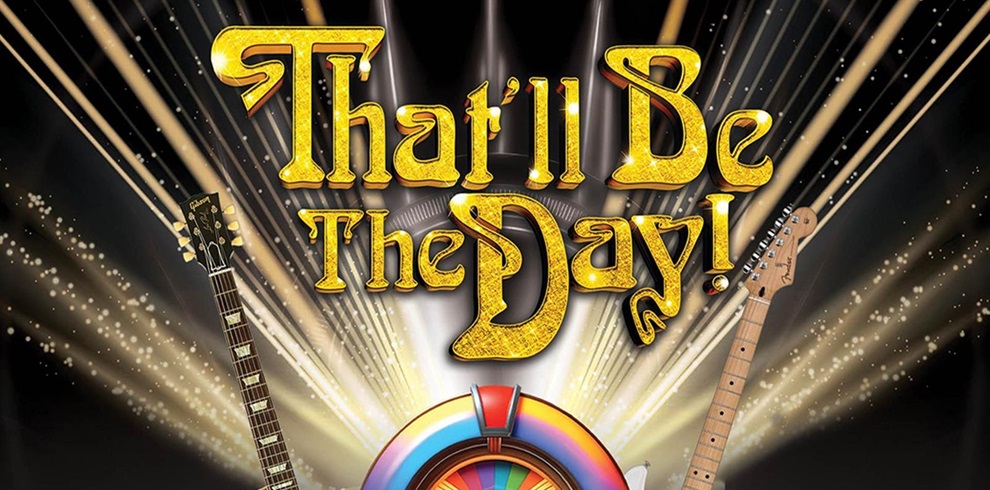 A vibrant promotional graphic featuring the golden text “That’ll Be The Day!” in a bold, retro style with sparkling light beams radiating outward. Below the text is a colorful jukebox with rainbow-like accents. On each side of the jukebox, there are two guitars—one electric and one acoustic—angled toward the center. The background is dark with glittering star-like effects, creating a lively and nostalgic atmosphere.