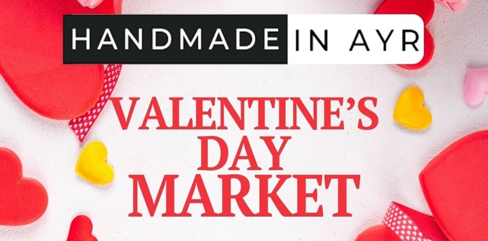 Promotional banner for the Handmade in Ayr Valentine’s Day Market, featuring red and pink heart decorations around the text ‘Valentine’s Day Market,’ with the Handmade in Ayr logo at the top