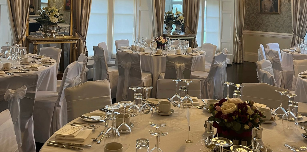 Tables set for wedding reception.