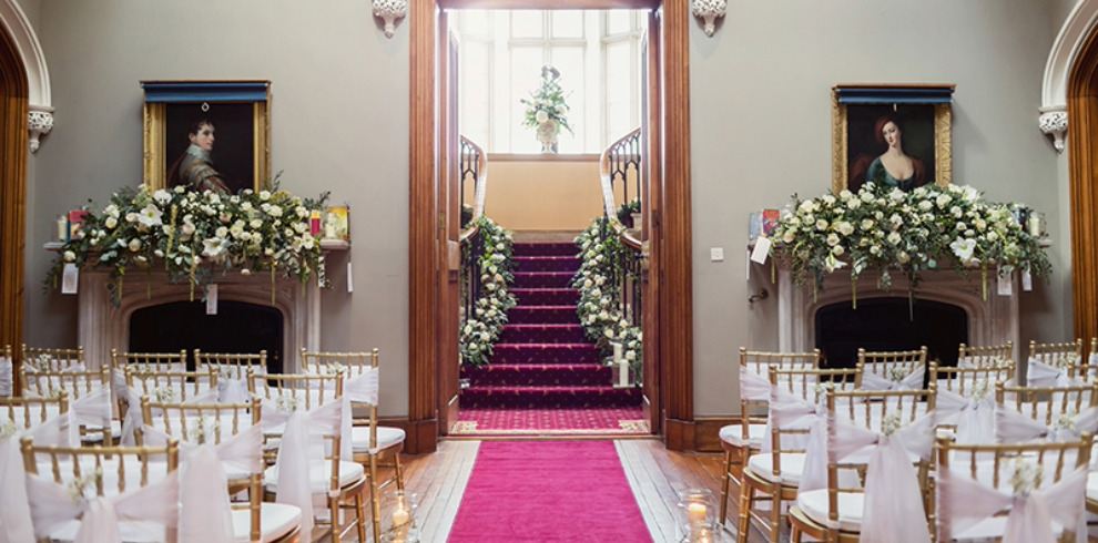 Hallway and chairs set for wedding ceremony.