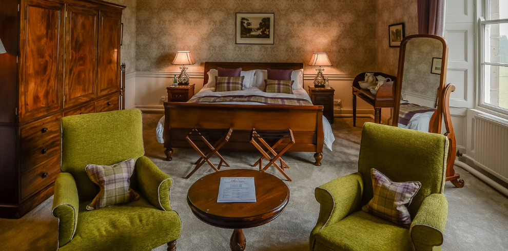 Elegantly decorated bedroom and seating area.