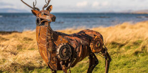 Metal scuplture of a deer made out of recycled scraps.
