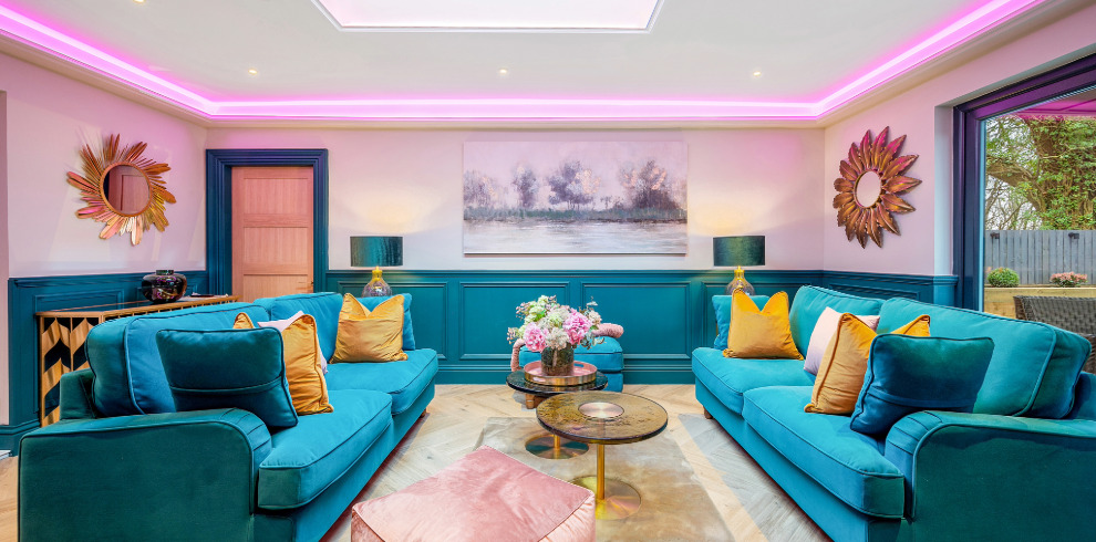 Comfortable seating arrangment in modern brightly coloured room.