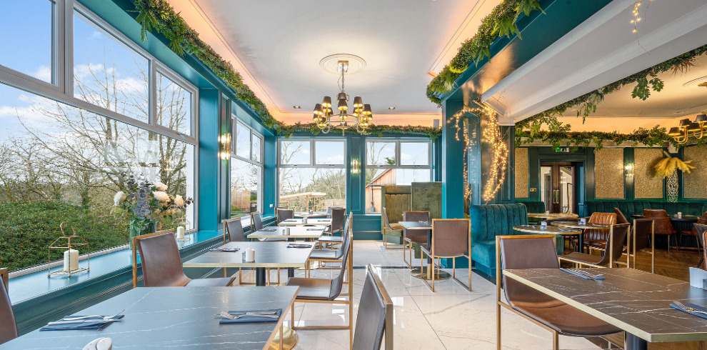 Dining area surrounded by windows.