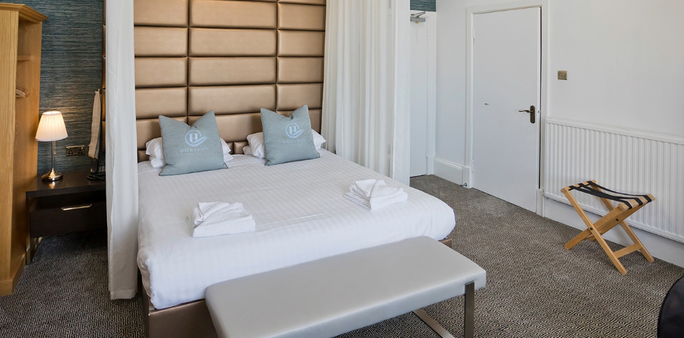 Clean, modern hotel bedroom.