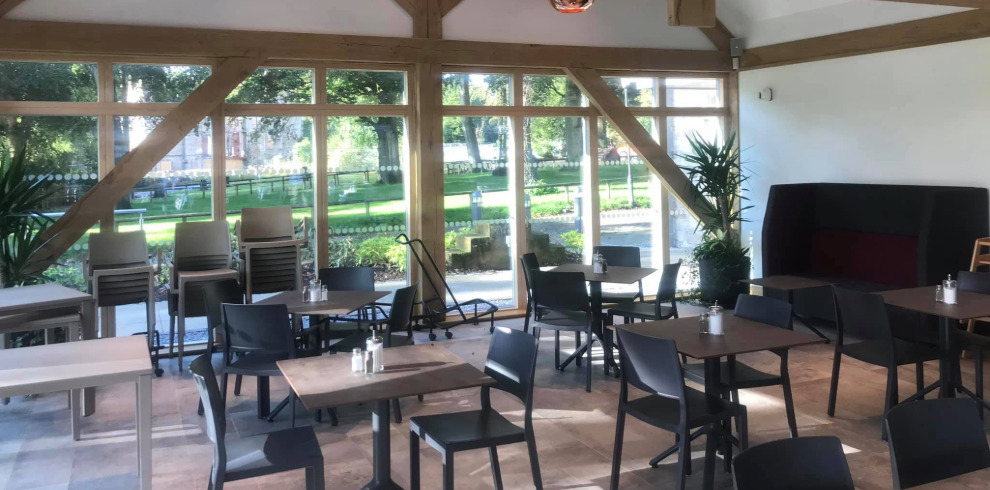 Inside seating area in cafe with views to golf course.
