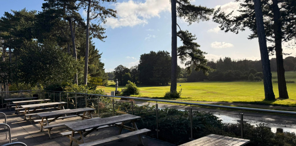 Outside seating area in cafe with views to golf course.