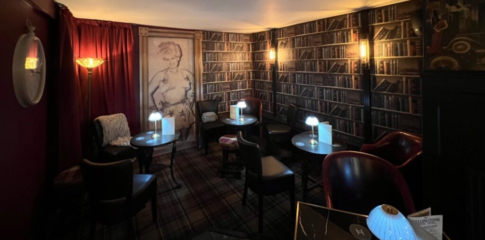 Speakeasy style interior of bar area.
