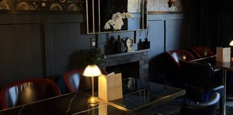 Speakeasy style interior of bar area.