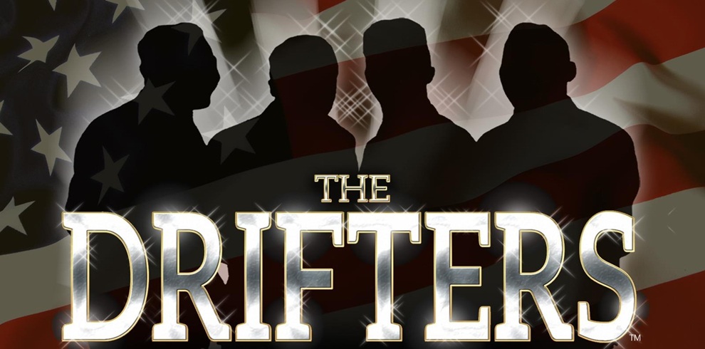 Promotional graphic for The Drifters featuring four silhouetted figures standing in front of an illustrated American flag background. The title ‘The Drifters’ appears in large, bold, illuminated lettering across the bottom of the image.