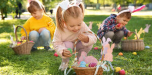 Children outside on an easter egg hunt.