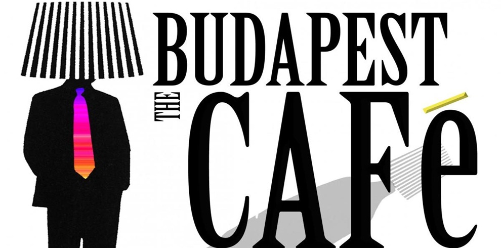 Promotional graphic for The Budapest Café featuring a stylised black silhouette of a person wearing a suit, with a striped lampshade in place of a head and a brightly coloured striped tie. Large black text to the right reads ‘Budapest Café.’ The overall design is minimalist and theatrical, combining café imagery with surreal, playful visual elements.