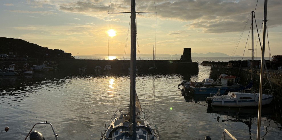 Sunset at a harbour with view of the pier.