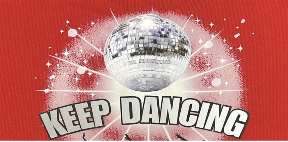 Graphic featuring a mirrored disco ball at the centre with sparkling light rays and starburst effects, set against a red textured background. Curved text below the disco ball reads ‘KEEP DANCING’ in bold, light-coloured lettering.