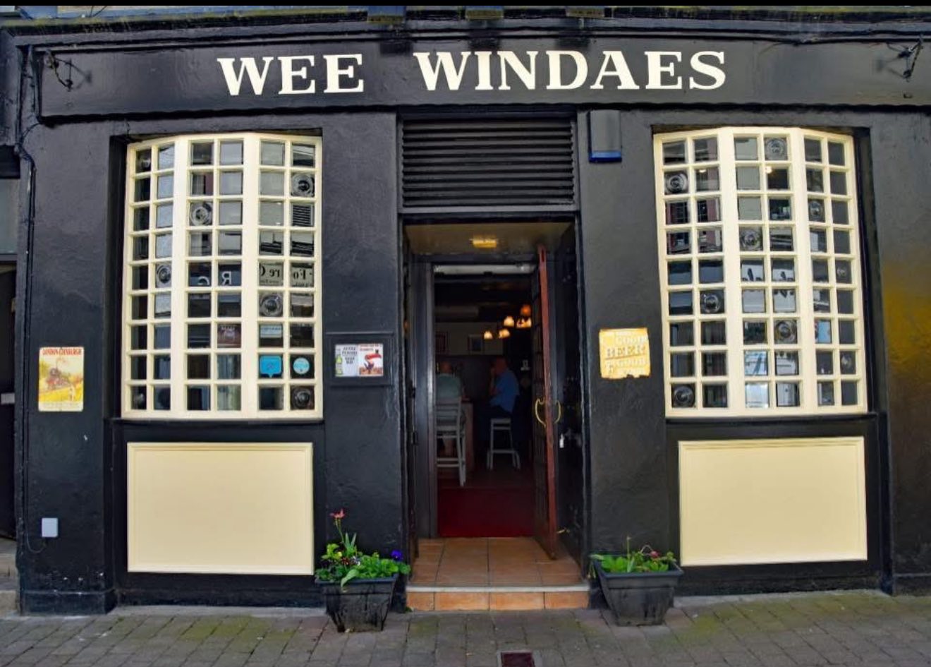 The exterior of a pub called 'Wee Windaes'.
