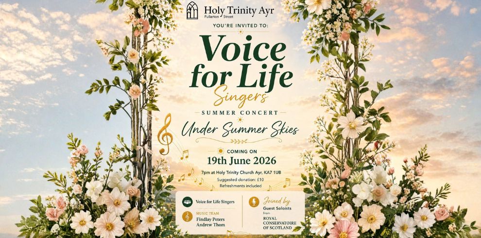 Promotional poster for “Under the Summer Skies” Voice for Life Singers summer concert at Holy Trinity Ayr. The design features an elegant floral arch with pastel flowers and greenery framing a soft sunset sky background. At the top is the Holy Trinity Ayr logo and “You’re Invited to.” The main title “Voice for Life Singers” appears in large green lettering, followed by “Summer Concert” and the subtitle “Under Summer Skies” in script font. Event details read: “19th June 2026, 7pm at Holy Trinity Church, Ayr, KA7 1UB,” with a suggested donation of £10 and refreshments included. Additional text highlights music by Findlay Peters and Andrew Thom and guest soloists from the Royal Conservatoire of Scotland.