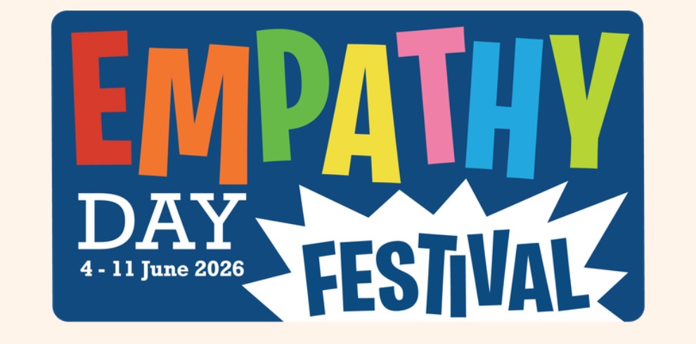Colourful “Empathy Day Festival” banner with bold, playful lettering in mixed bright colours on a dark blue background. The text reads “EMPATHY DAY 4–11 June 2026 FESTIVAL,” with “Festival” placed inside a white starburst shape at the bottom.