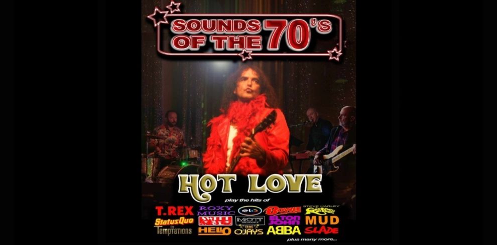 Promotional image for “Sounds of the 70’s” featuring the band Hot Love performing on stage, with a central performer in a bright red outfit playing guitar under stage lights, accompanied by other musicians in the background. The design includes bold retro-style text reading “Sounds of the 70’s” and “Hot Love,” along with artist names such as T. Rex, Roxy Music, ELO, David Bowie, Elton John, ABBA, Slade, and more, set against a dark, glittering backdrop.