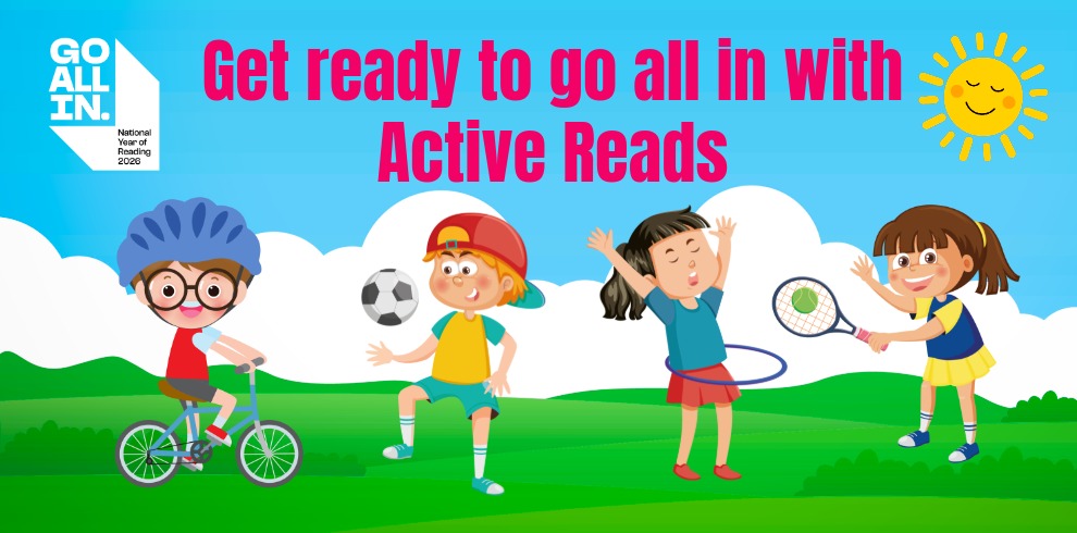 Colorful promotional banner for “Active Reads” showing four children playing outdoors on green grass under a blue sky with clouds and a bright sun in the top-right corner. From left to right, one child rides a bicycle while wearing a helmet, another child kicks a soccer ball, a third child plays with a hula hoop, and a fourth child holds a tennis racket and ball. Large pink text at the top reads, “Get ready to go all in with Active Reads.” A logo on the left side says “GO ALL IN – National Year of Reading 2026.