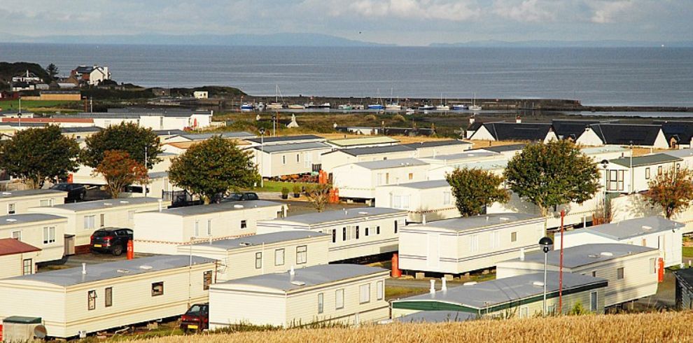 An image of a caravan park near the sea.
