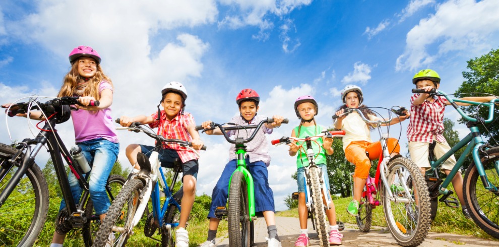 Young children on bicycles.