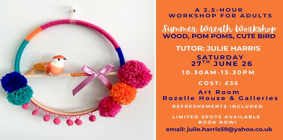 A promotional poster for a summer wreath workshop. On the left side, a circular handmade wreath hangs on a white wall. The wreath is wrapped in multicolored yarn segments (pink, orange, teal, and blue) and decorated with bright pom poms and small tassels. A small decorative bird sits on a horizontal wooden dowel across the lower part of the ring, and a pink ribbon bow is tied at the bottom center. On the right side, the poster has an orange background with text in white and navy blue. The text reads: “A 2.5-hour workshop for adults. Summer Wreath Workshop: wood, pom poms, cute bird. Tutor: Julie Harris. Saturday 27th June 26, 10.30am–13.30pm. Cost: £35. Art Room, Rozelle House & Galleries. Refreshments included. Limited spots available – book now! Email: julie.harris59@yahoo.co.uk.