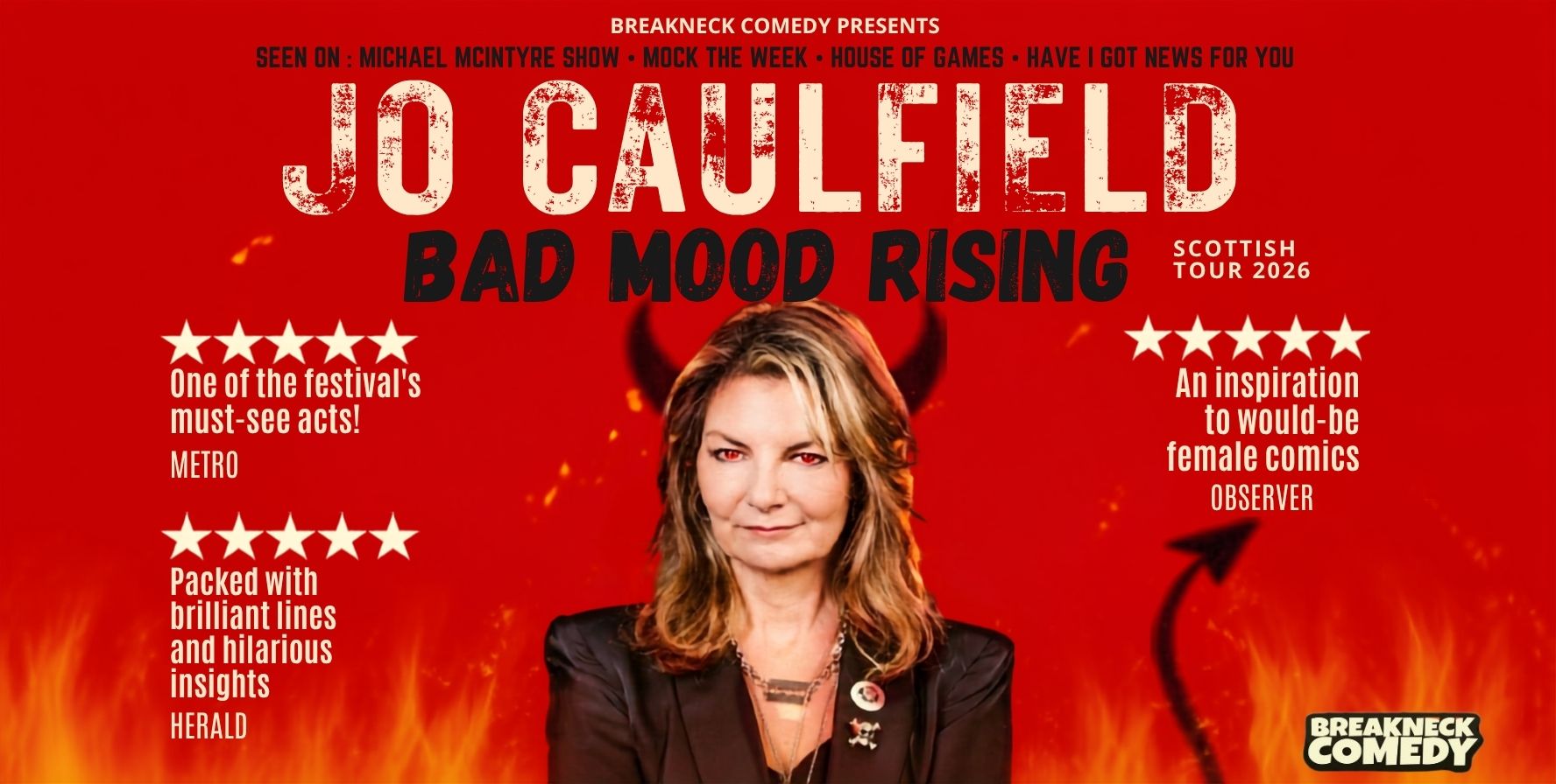 Promotional image for a comedy tour on a bright red background with flames along the bottom and small devil-themed graphics, including horns behind the central figure and a tail with an arrow tip. Large text reads “JO CAULFIELD” and “BAD MOOD RISING,” with “Scottish Tour 2026” to the right. A person in a dark blazer is centered in the poster. Across the top, text says “Breakneck Comedy Presents” and lists appearances on television shows. On the left and right are five-star review quotes from Metro, Herald, and Observer praising the act. The Breakneck Comedy logo appears in the lower-right corner.