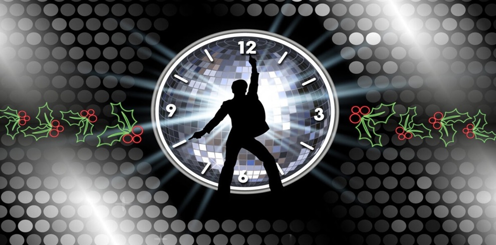 Silhouette of a person in a dance pose standing in front of a large disco ball designed as a clock, with the hands pointing to midnight. Bright spotlights shine across a black background filled with silver circular light patterns. Decorative holly leaves and red berries appear on both sides, creating a festive holiday and New Year's celebration theme.