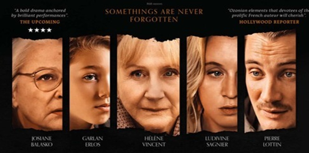 Movie poster featuring five close-up portrait panels arranged side by side against a black background. Each panel shows a different person's face cropped vertically. Across the top, review quotes and star ratings are displayed, with the central tagline reading, “SOMETHINGS ARE NEVER FORGOTTEN.” Names of the cast appear beneath each portrait. The poster uses warm tones and high-contrast lighting, creating a dramatic and serious atmosphere.