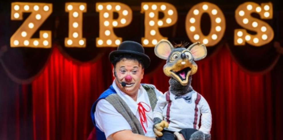 Cicus clown with rat puppet.