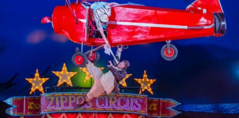 Circus performance involving a small aircraft.