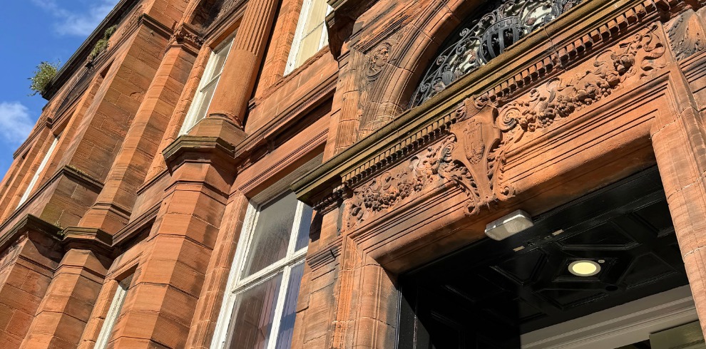 Red sandstone brickwork to entrance of a Carnegie Library built building.