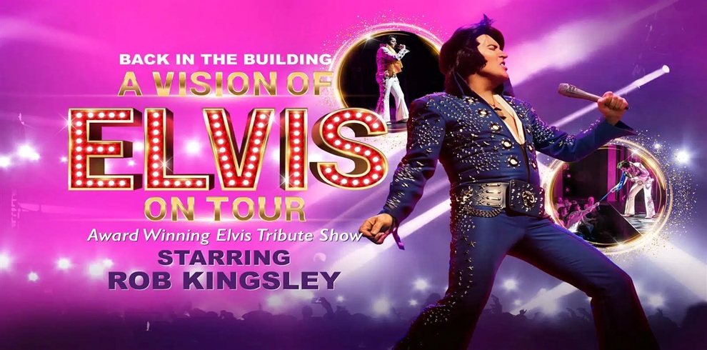 Promotional banner for A Vision of Elvis On Tour. The image features a performer in a blue, rhinestone-studded jumpsuit holding a microphone and posing on a brightly lit stage. The background is filled with pink and purple lighting effects, spotlights, and silhouettes of a concert audience. Large illuminated text reads, "Back in the Building: A Vision of Elvis On Tour" with additional text stating "Award Winning Elvis Tribute Show" and "Starring Rob Kingsley." Two circular inset images show additional stage performance scenes.