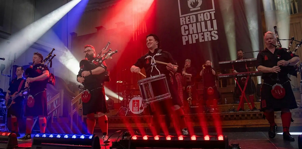 A picture of Red Hot Chilli Pipers performing on stage.