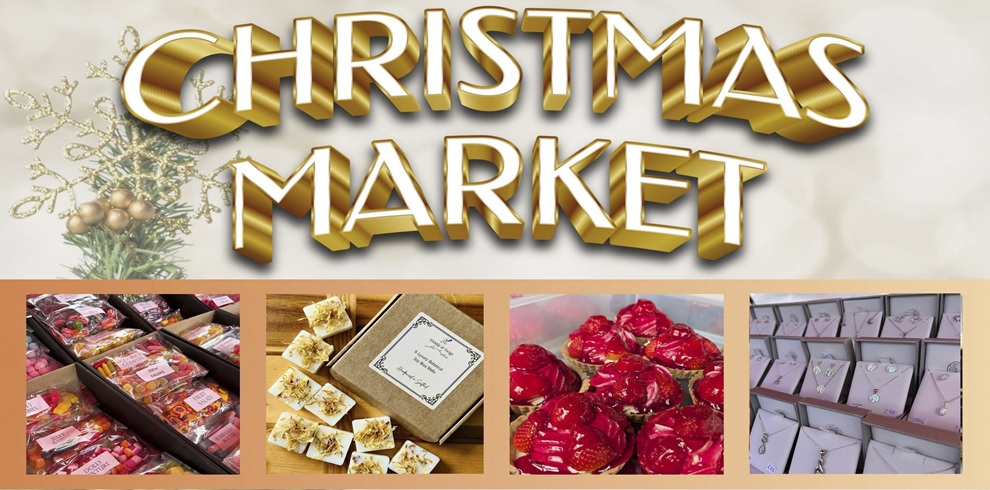 Promotional banner for a Christmas Market. Large gold 3D text reading “CHRISTMAS MARKET” appears across the top beside a festive snowflake decoration and seasonal greenery. Along the bottom are four photos showcasing market products: colourful sweets and confectionery, handmade wax melts or gift items in a presentation box, red glazed strawberry-topped pastries, and a display of silver jewellery on pink presentation cards. The design uses warm gold and cream tones with a festive holiday theme.