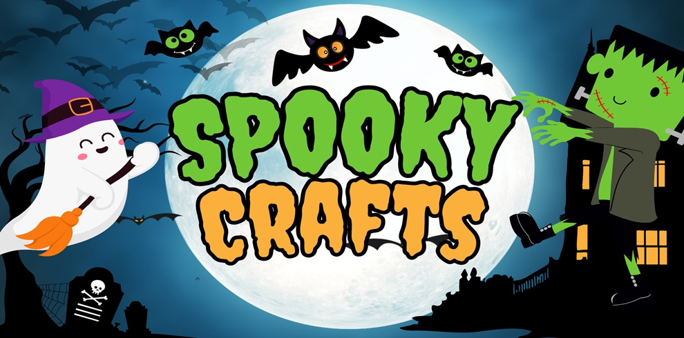 Colourful Halloween-themed promotional graphic for “Spooky Crafts.” The words Spooky Crafts appear in large green and orange cartoon lettering in front of a glowing full moon. A friendly ghost wearing a purple witch’s hat rides a broomstick on the left, while a smiling Frankenstein-style character sits on a haunted house on the right. Black bats fly across a dark blue night sky, with silhouettes of gravestones, trees and spooky buildings in the background. The design uses bright, child-friendly Halloween imagery.
