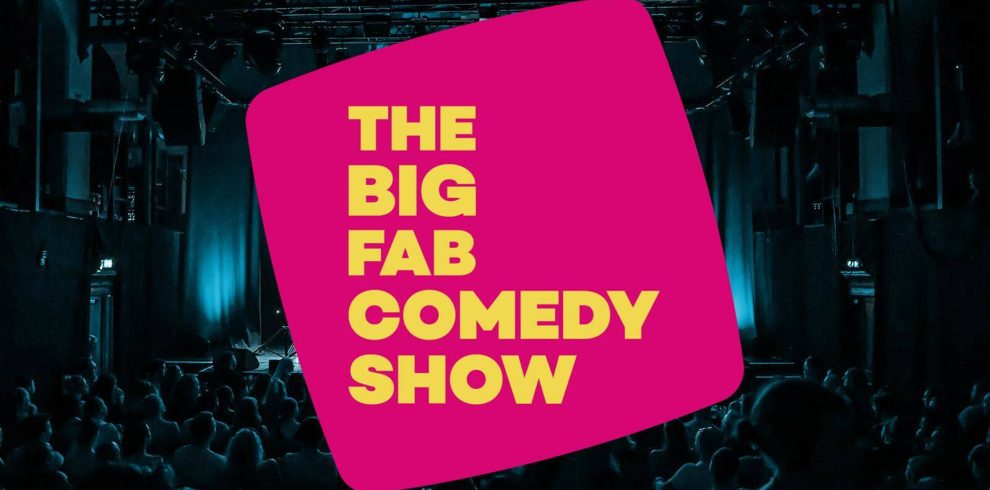 Black background with the title The Big Fab Comedy Show in yellow font on a pink cubes shape background.