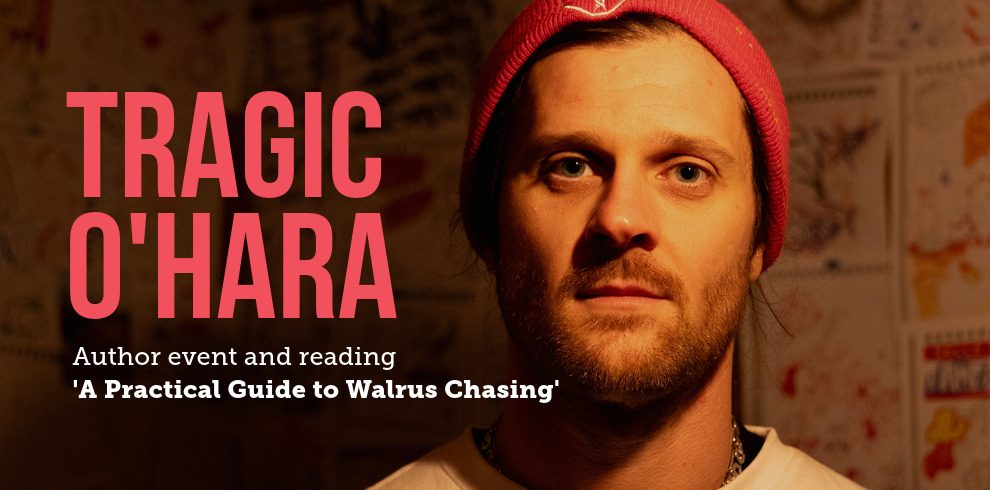 This is an image promoting an author event featuring Tragic O’Hara. The main text reads: "Tragic O'Hara" in bold red letters. Below it, smaller text states: "Author event and reading 'A Practical Guide to Walrus Chasing'." The image features a close-up of Tragic O’Hara wearing a red beanie and a neutral expression, with a warm background featuring abstract art or sketches on the wall.