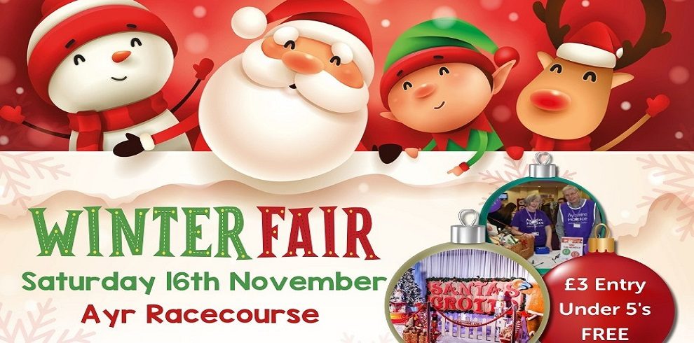 A promotional image for a "Winter Fair" event. The main characters at the top of the image are festive figures: a snowman, Santa Claus, an elf, and a reindeer, all smiling in a cheerful winter scene. The text in the middle of the image reads: "WINTER FAIR Saturday 16th November Ayr Racecourse" In smaller text on the right side, it notes: "£3 Entry Under 5's FREE." There are two small circular images near the bottom: one shows volunteers at a booth, and the other shows a festive "Santa's Grotto" scene, hinting at activities at the fair. The overall design is colorful, using traditional red and green holiday colors, with a playful and festive atmosphere.