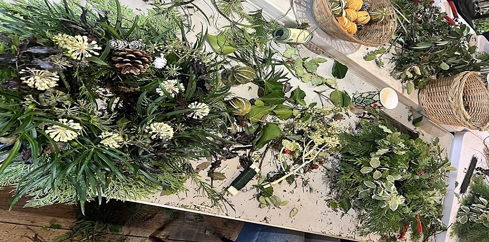 A picture of Christmas wreaths on a table.